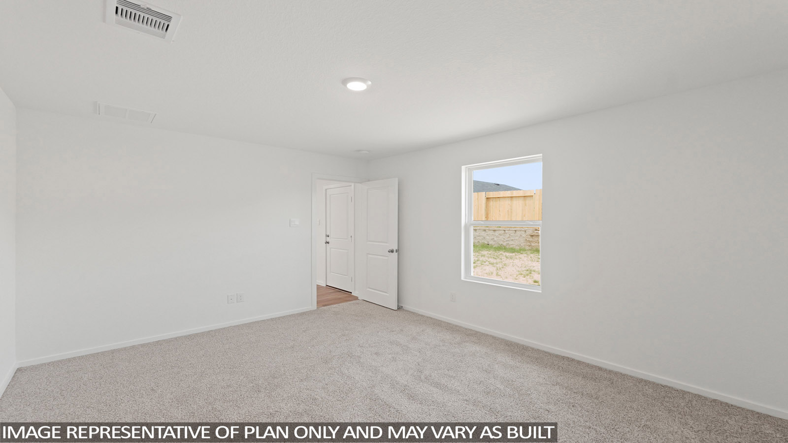 Large Primary bedroom with shag carpet flooring and bright window