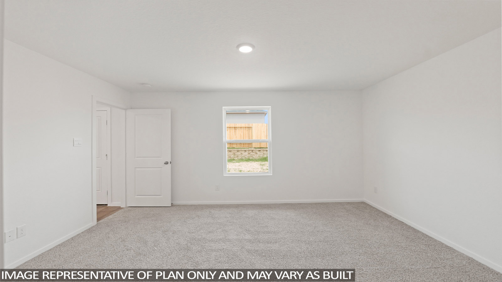 Large Primary bedroom with shag carpet flooring and bright window