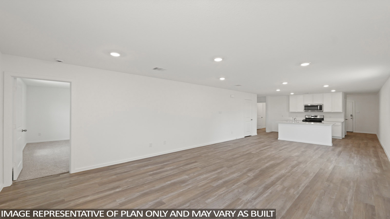 Spacious living area with vinyl flooring and bright windows in Willis TX