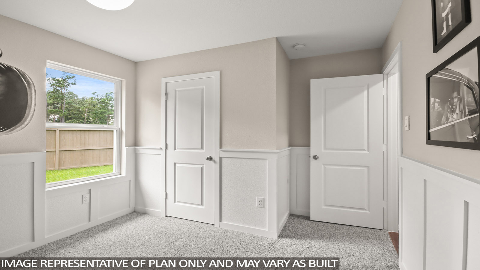 Secondary bedroom with carpet flooring