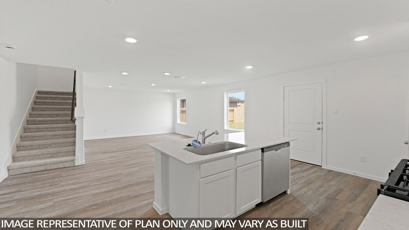 Kitchen with an island and vinyl floor