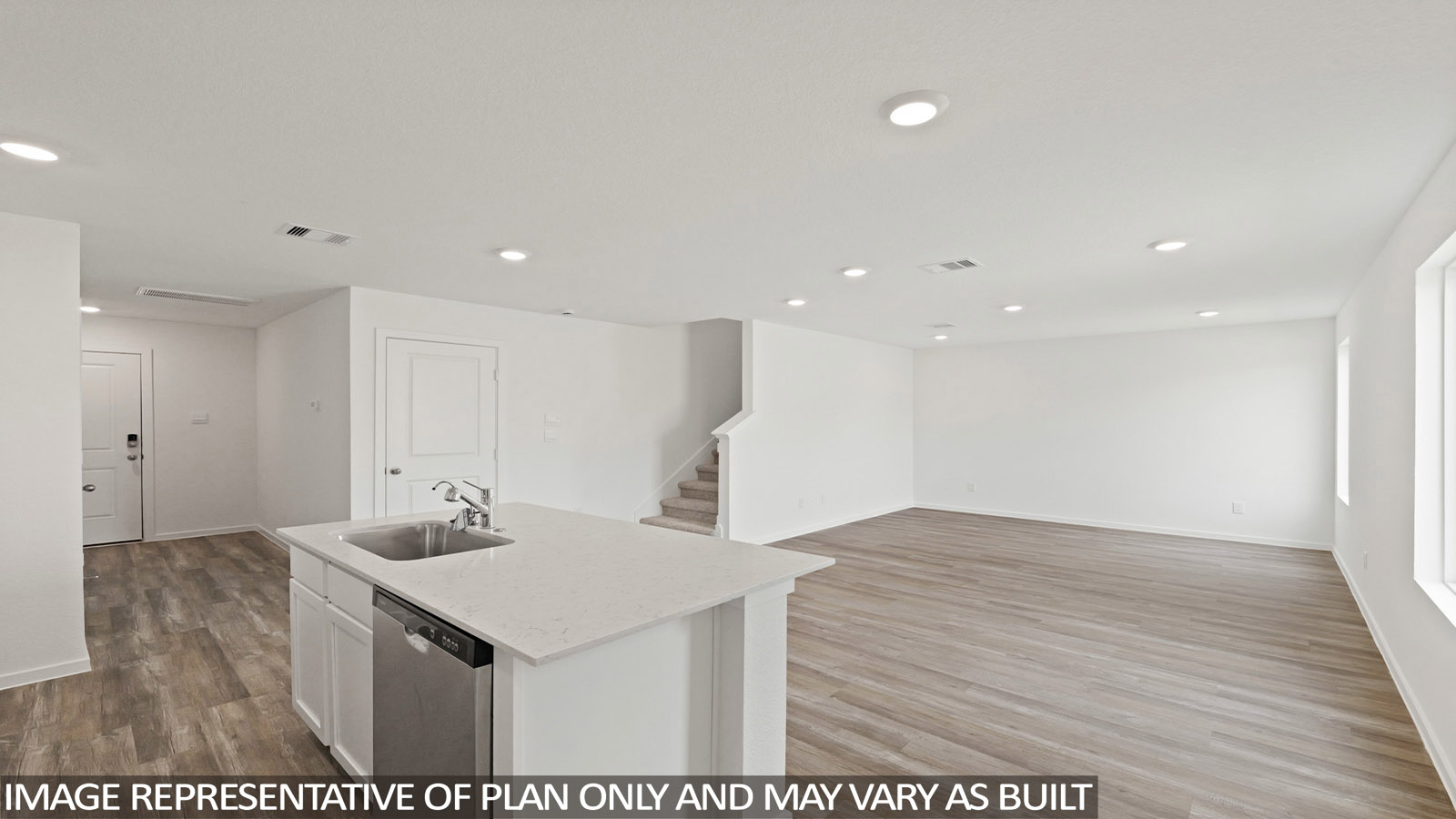 Kitchen with an island and vinyl floor