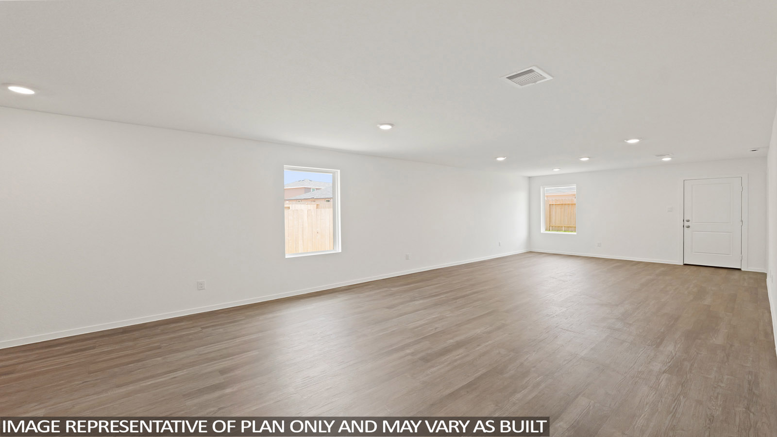 Spacious living area with vinyl flooring and bright windows in Willis TX