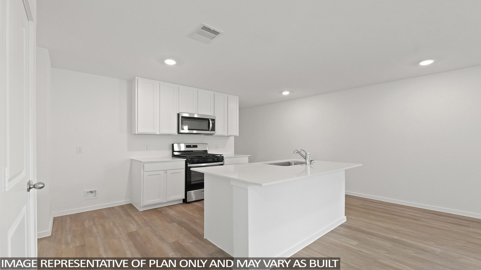 Kitchen with quartz countertops and an island and vinyl floor