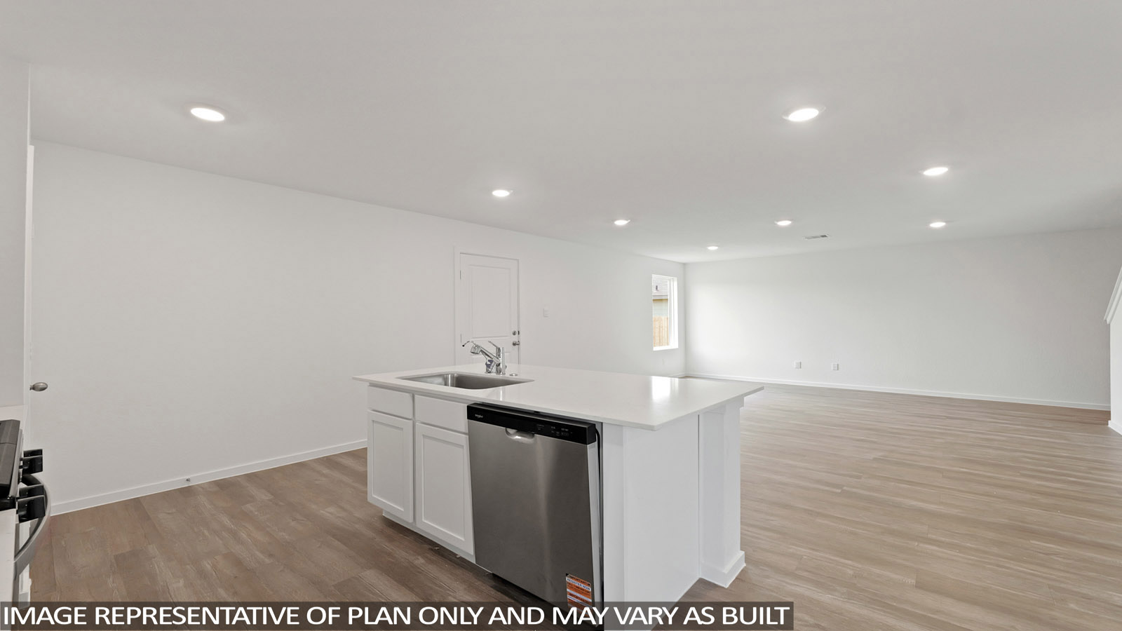 Kitchen with an island and vinyl floor