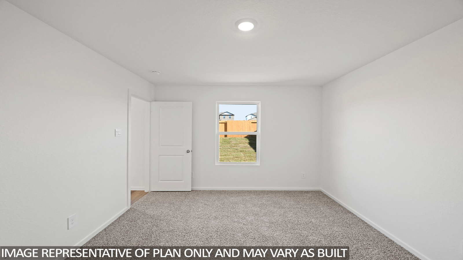 Large Primary bedroom with shag carpet flooring and bright window