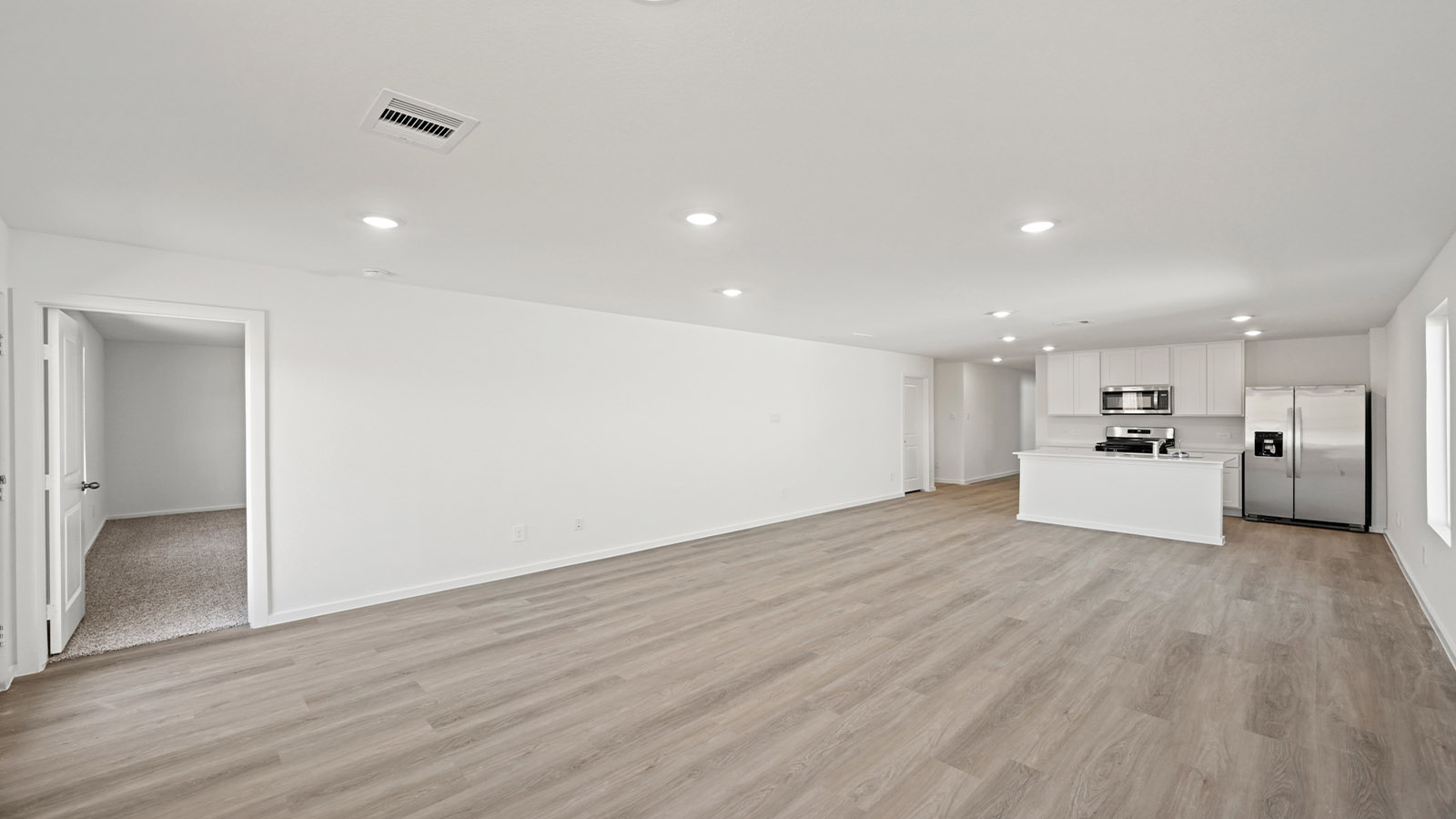 Open concept living, dining, and kitchen area