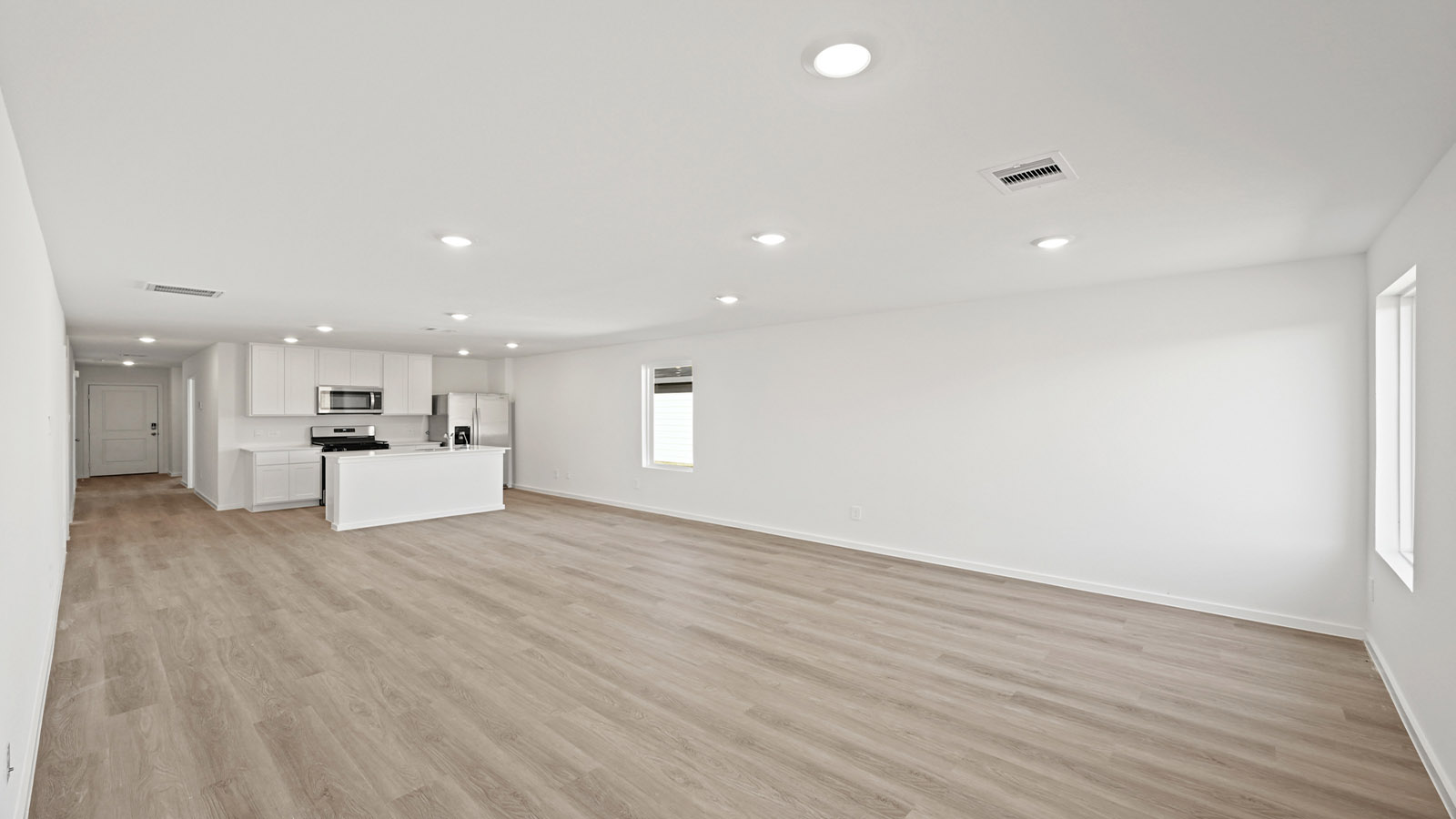 Open concept living, dining, and kitchen area