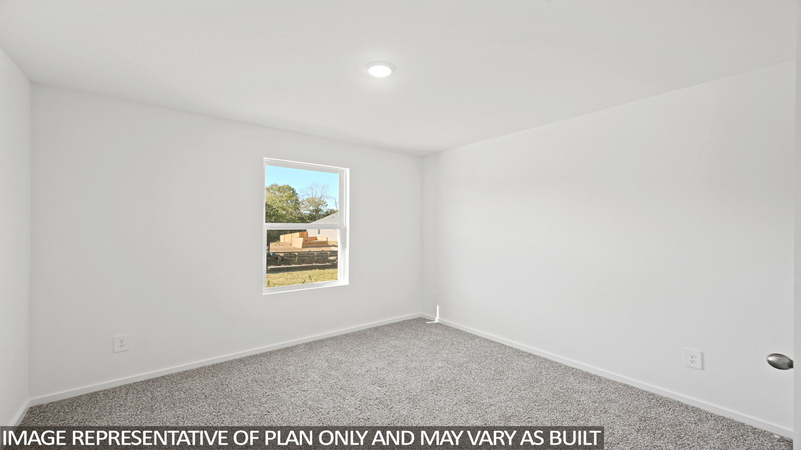 Secondary bedroom with shag carpet flooring and bright window