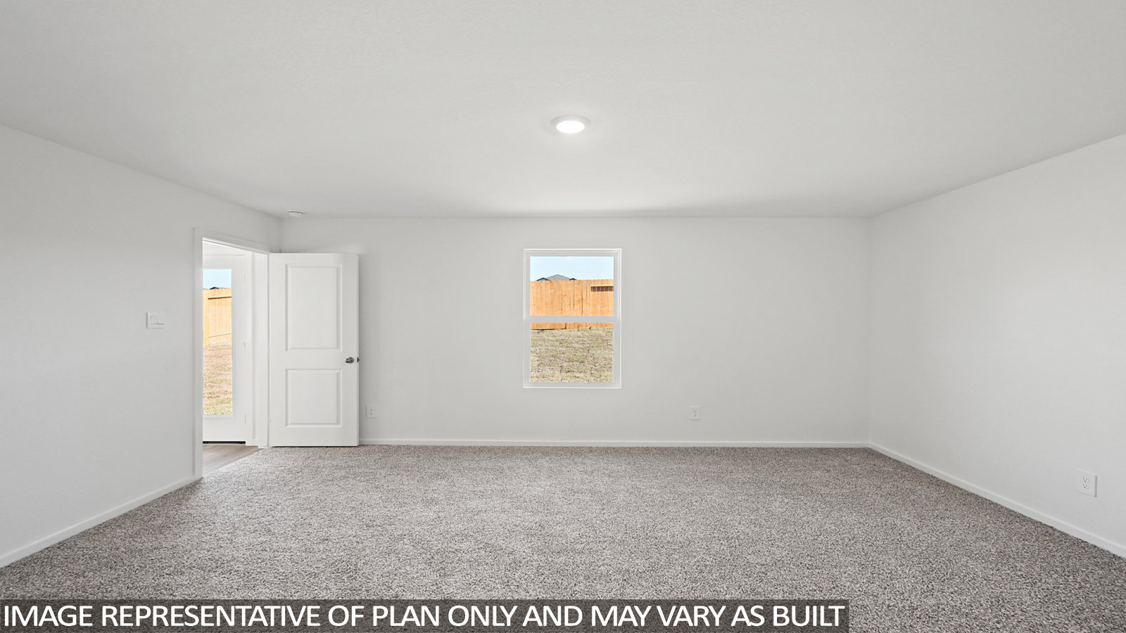 Large Primary bedroom with shag carpet flooring and bright window