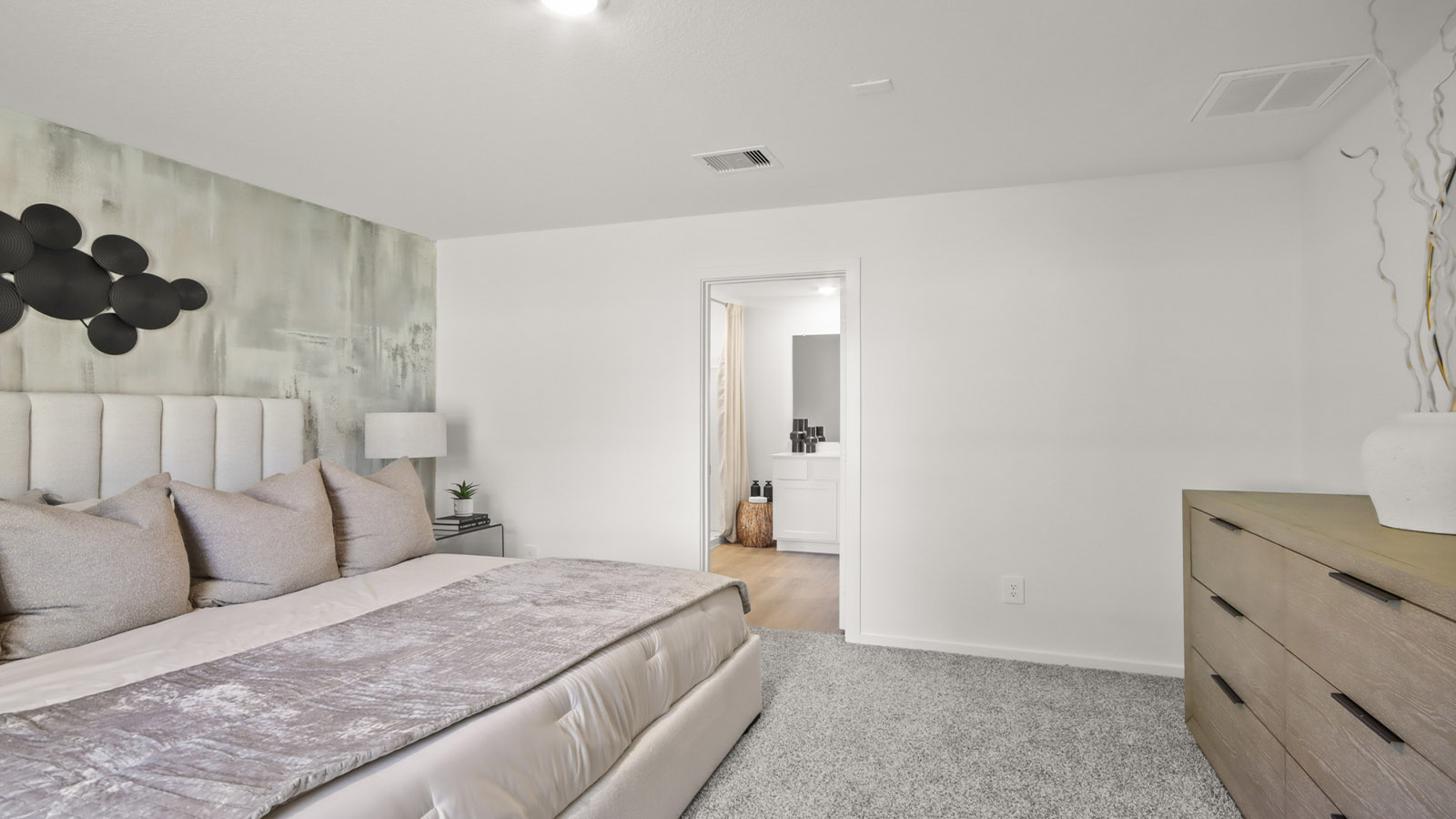 Primary bedroom with carpet flooring