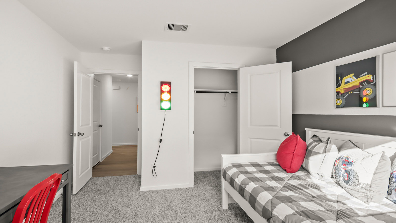 Secondary bedroom with carpet flooring