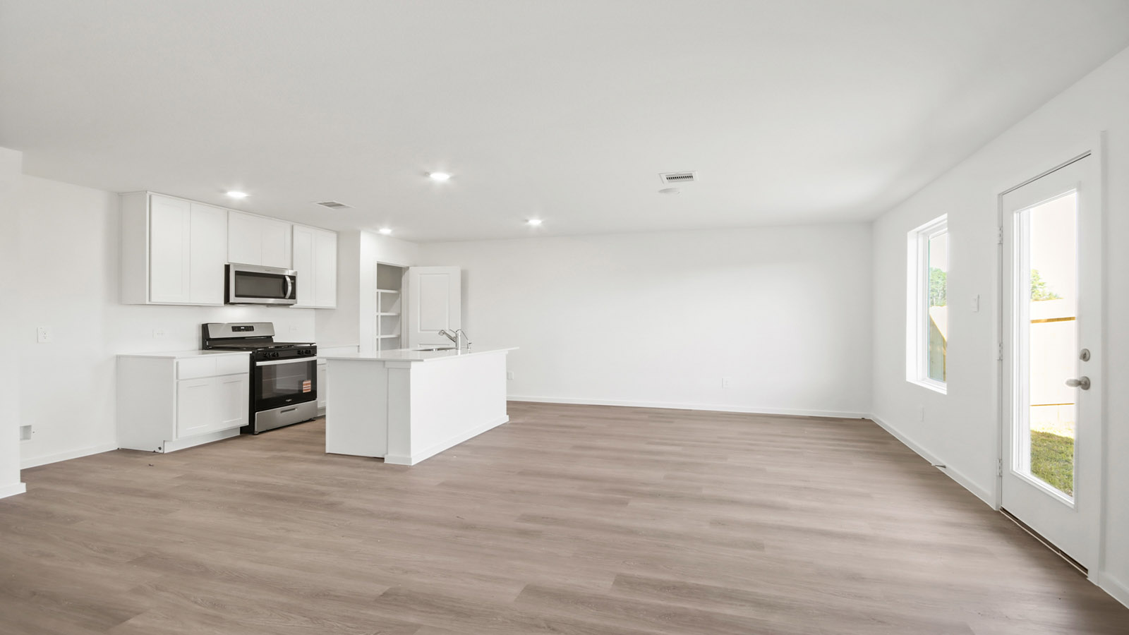 Open concept living, dining, and kitchen area