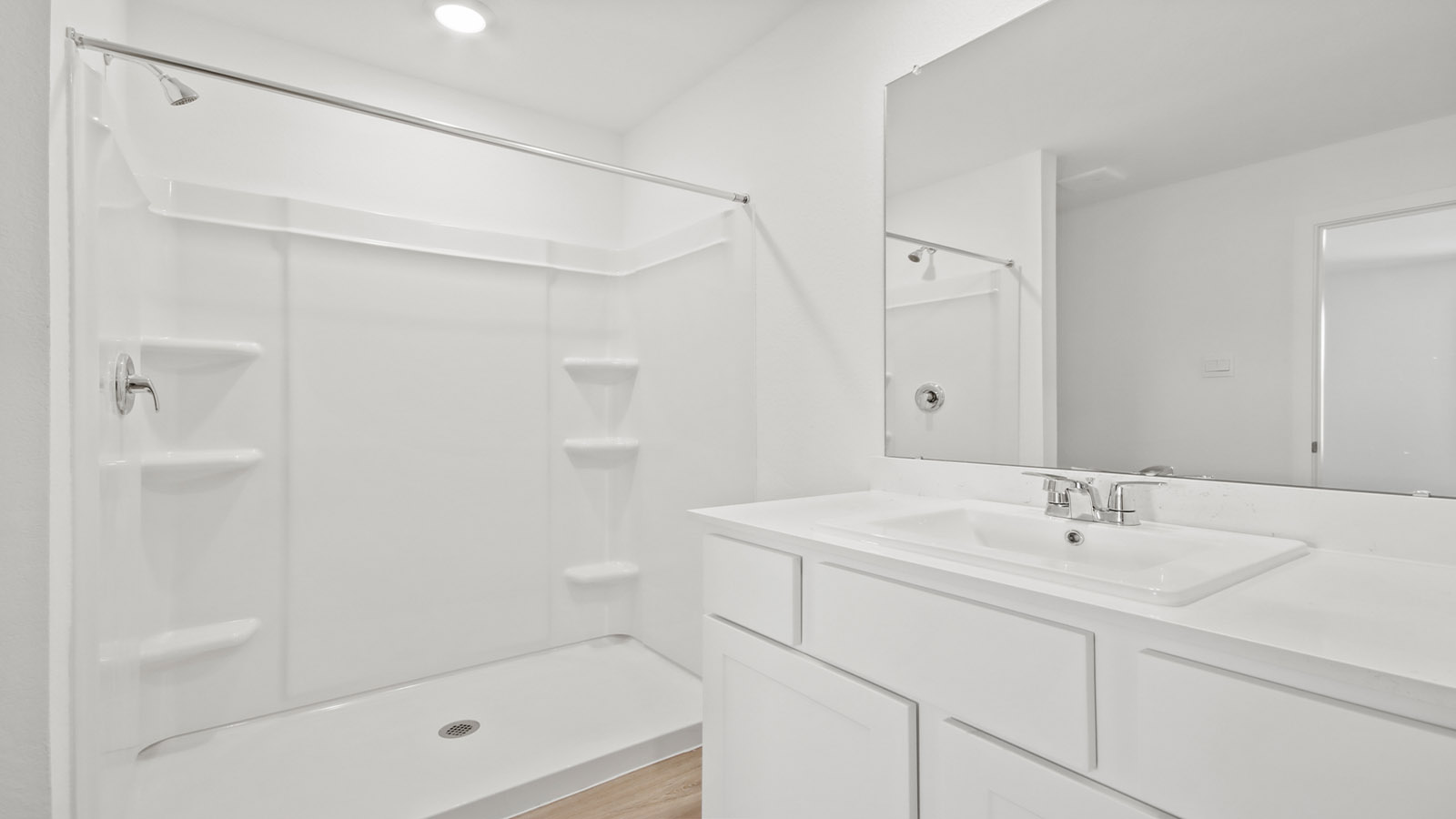 Primary bathroom with shower and linen storage
