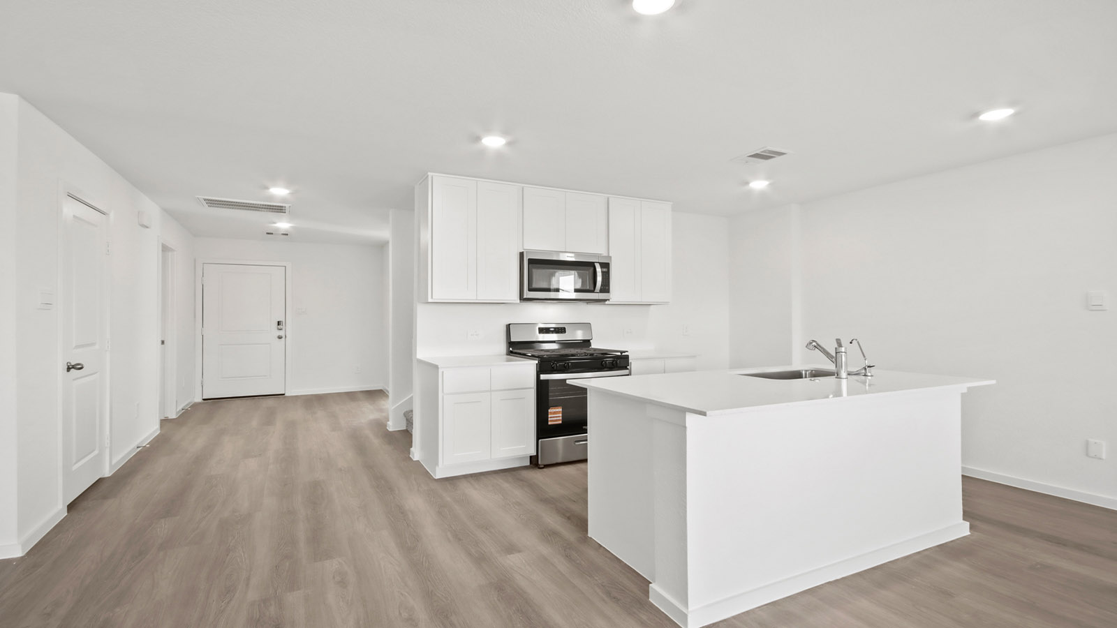 Open concept living, dining, and kitchen area