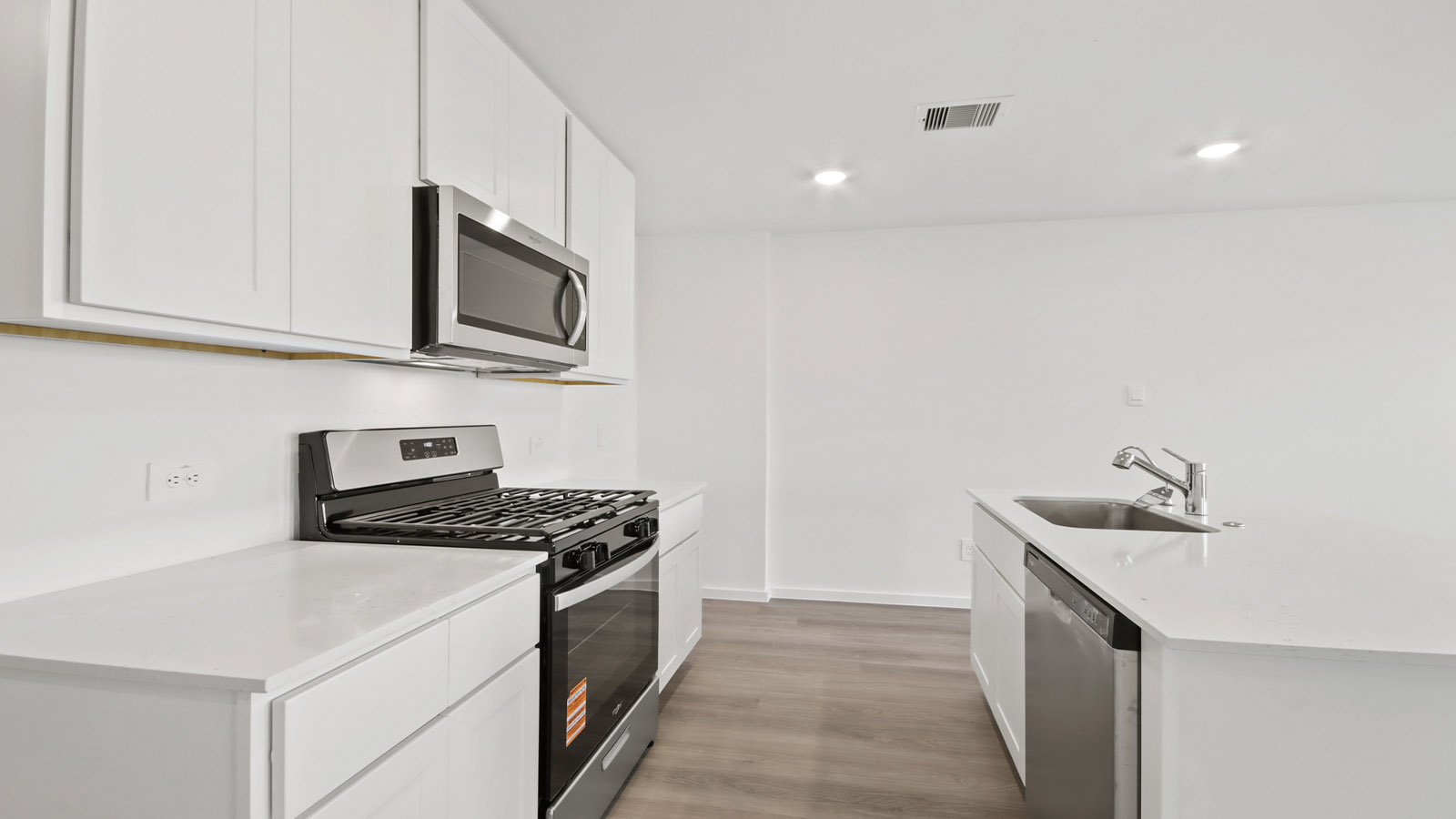 Open concept living, dining, and kitchen area