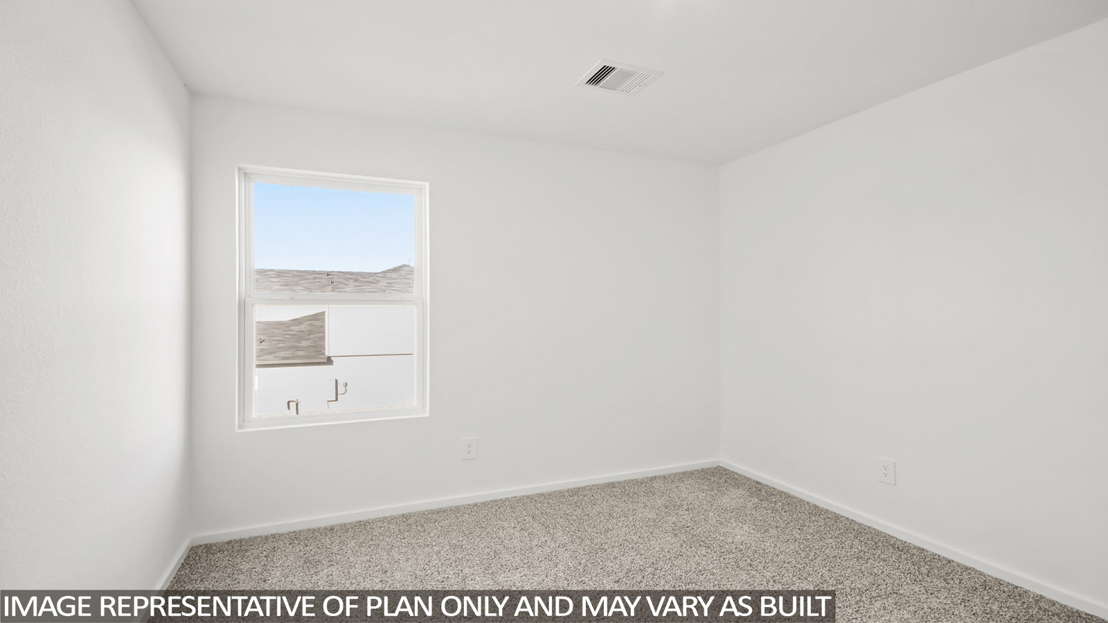 Second level secondary bedroom with carpet flooring and bright window