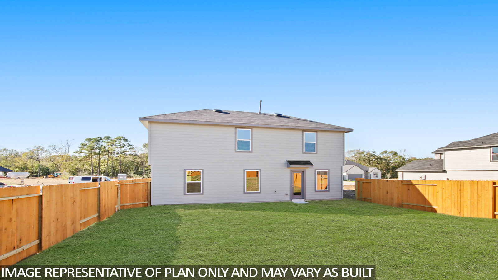 back of house with james hardie siding and glass back door