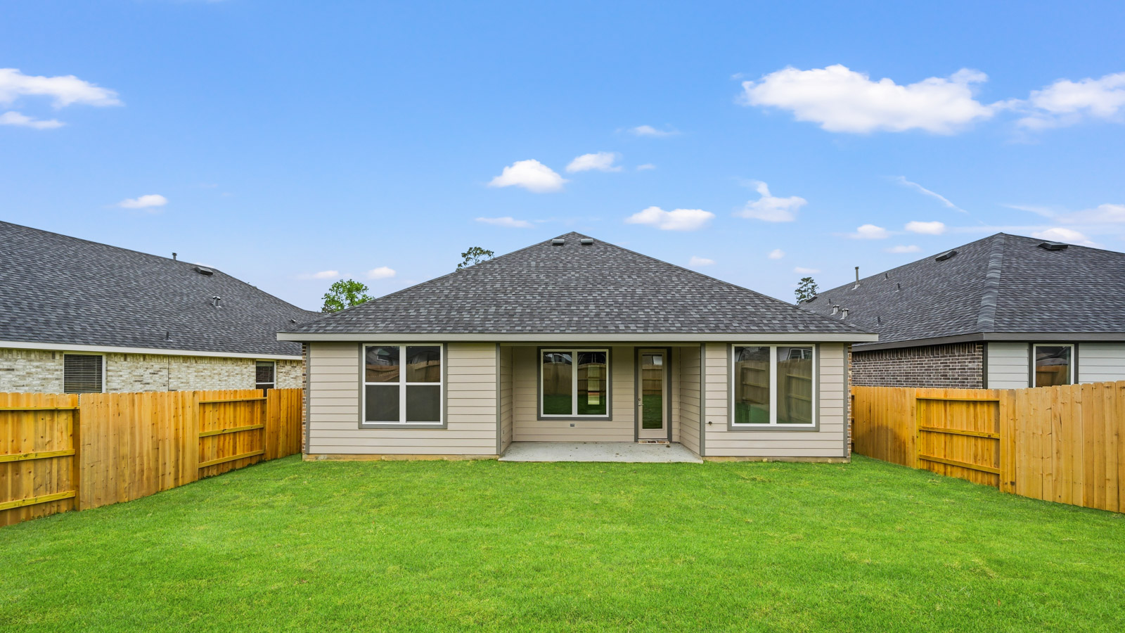 covered patio with jamies hardie siding and overhead lighting