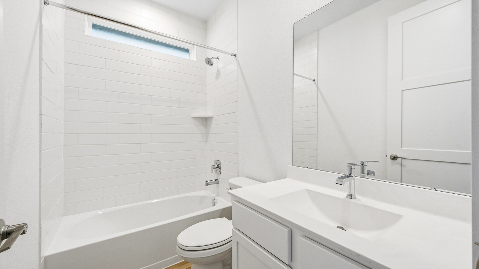 Secondary bathroom with tub/shower combo with quartz counter tops in Magnolia TX