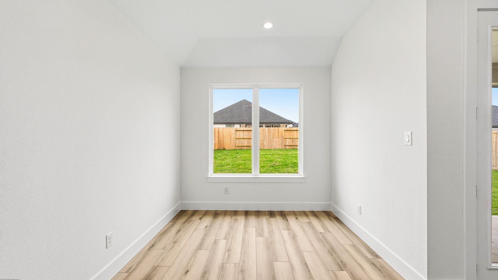 Dining area with vinyl flooring located off from the living room area in Magnolia TX