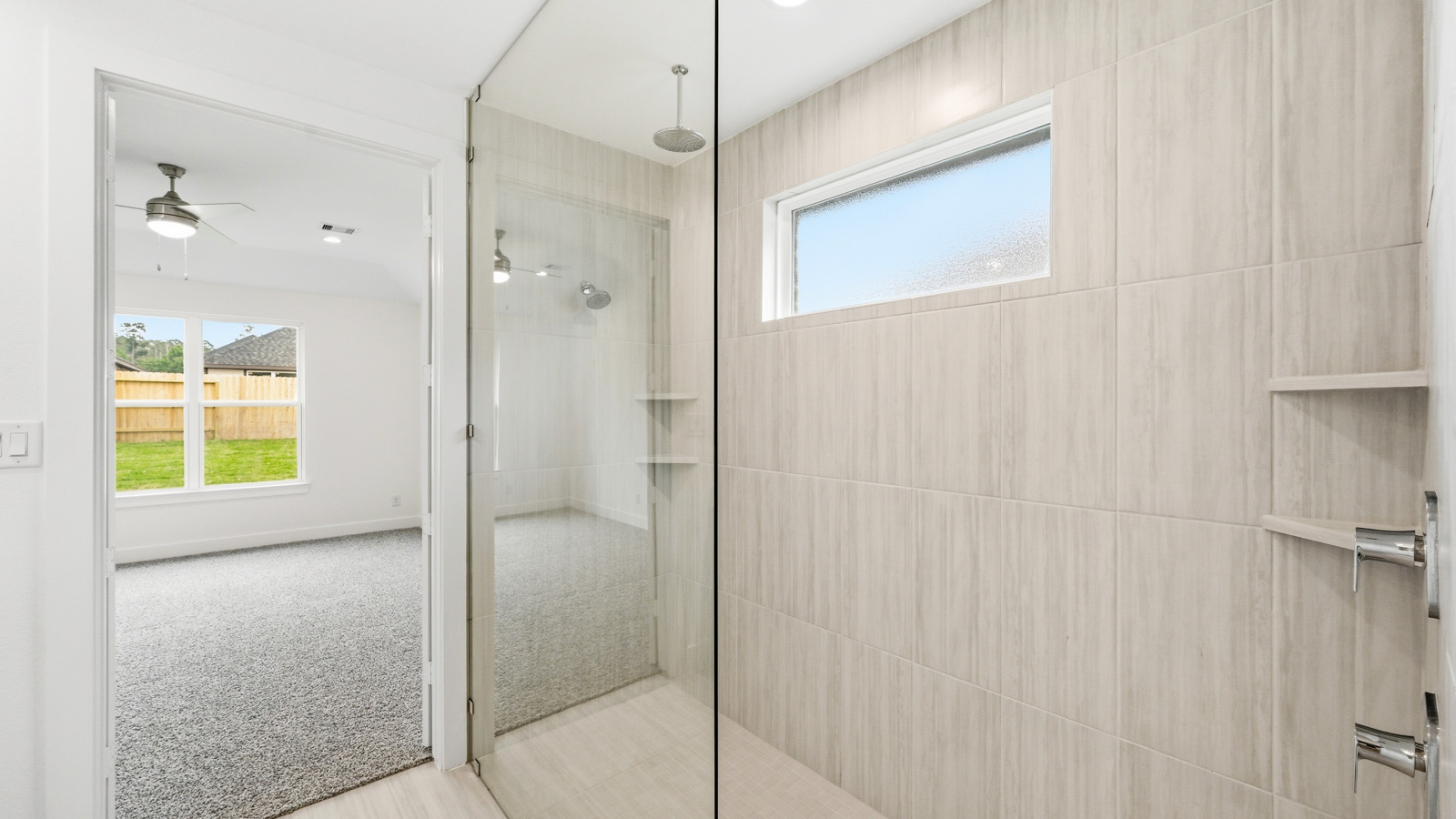 Primary bathroom with stand-alone shower with tiles and semi frameless glass in Magnolia TX