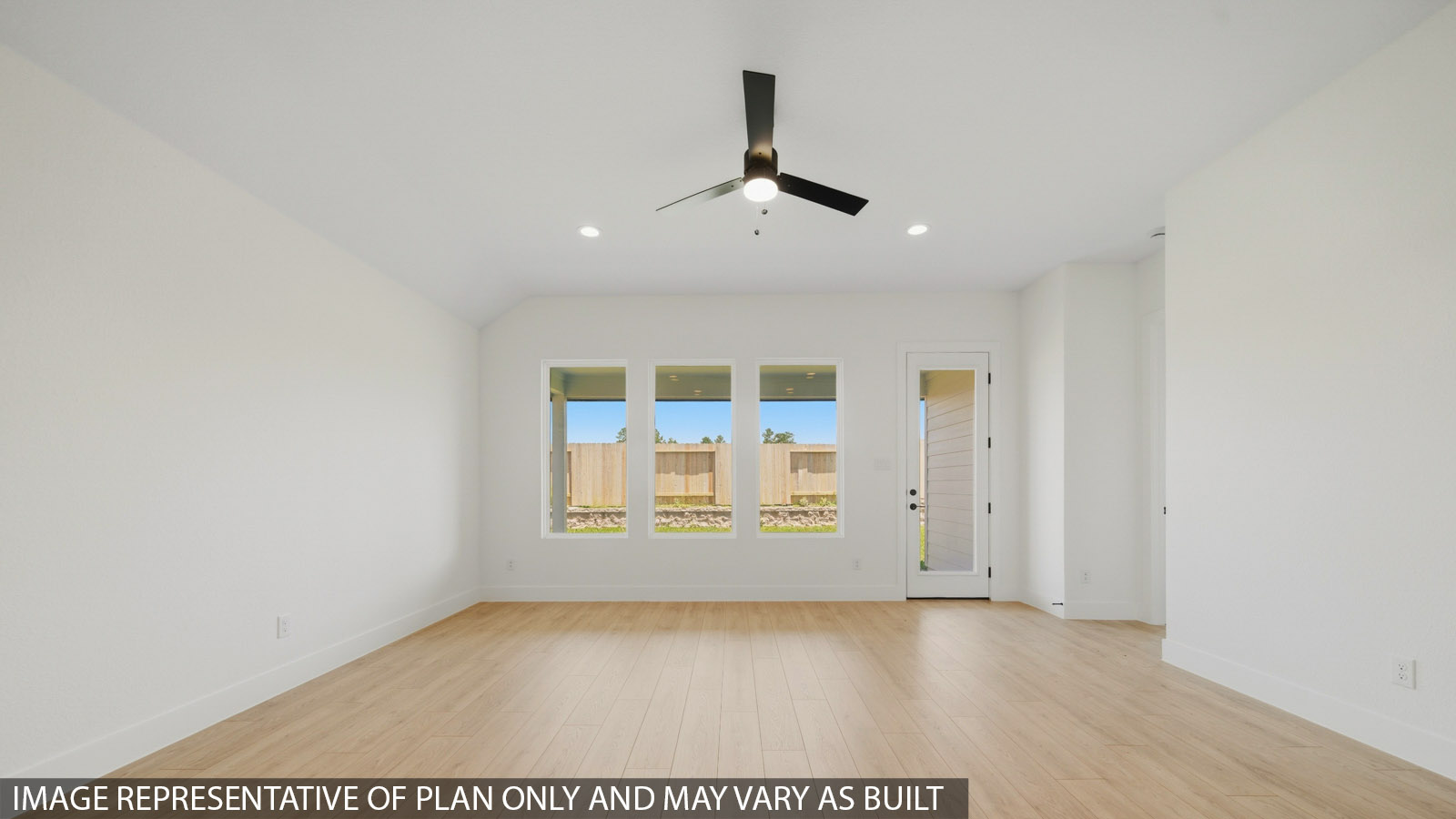 Spacious living area with vinyl flooring and bright windows in Magnolia TX
