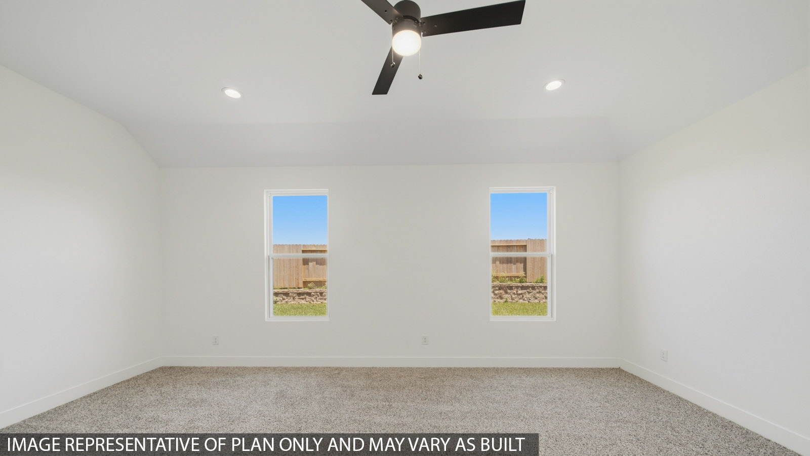 Large Primary bedroom with shag carpet flooring and bright window