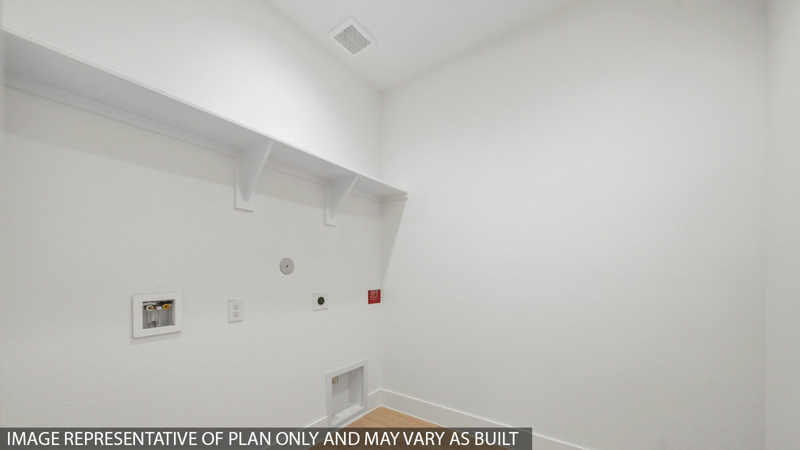 Utility room with storage located off the entry hallway and garage door
