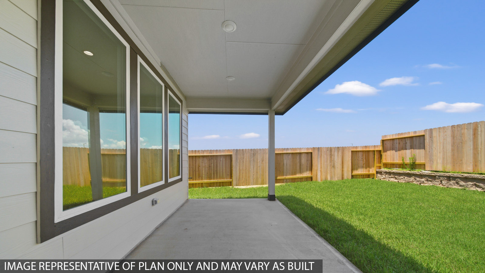 covered patio with jamies hardie siding and overhead lighting