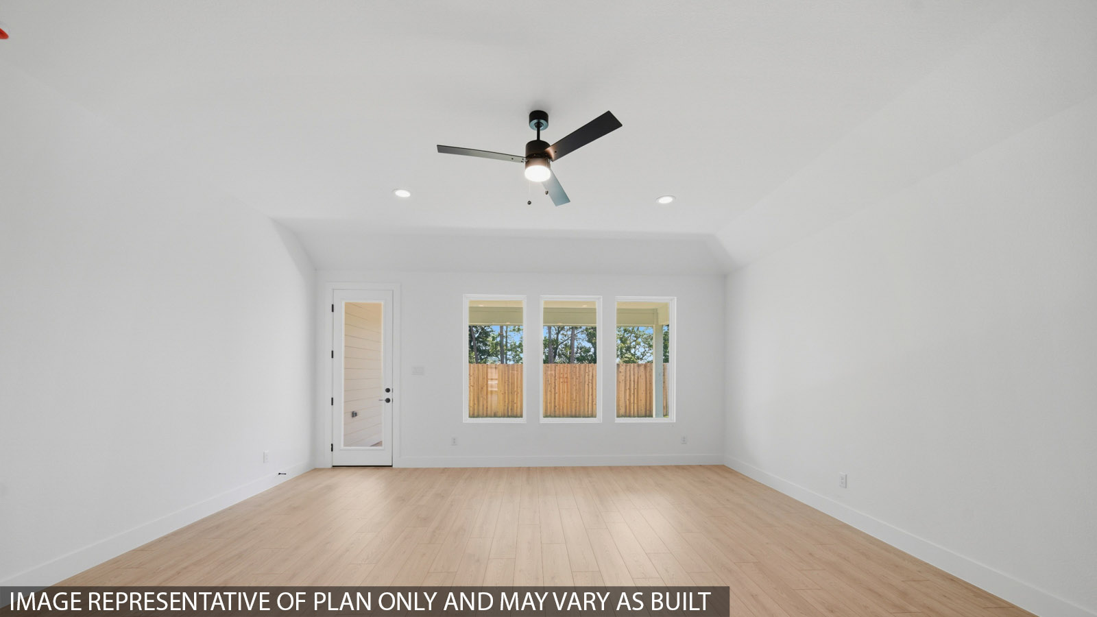 Spacious living area with vinyl flooring and bright windows in Magnolia TX