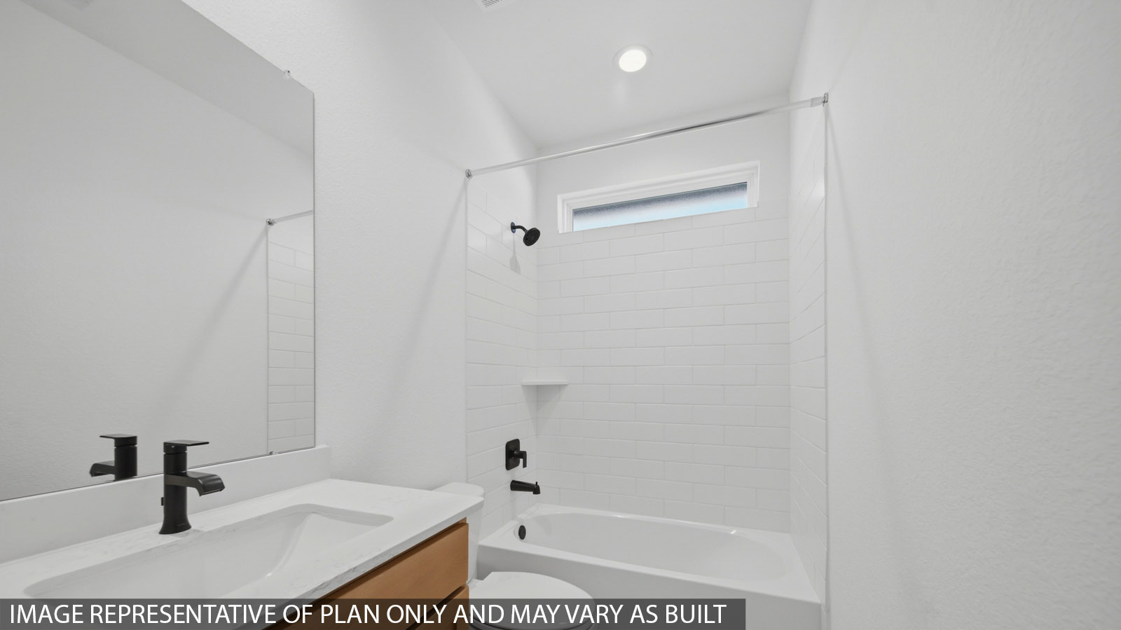 Secondary bathroom with tub/shower combo with quartz counter tops in Magnolia TX