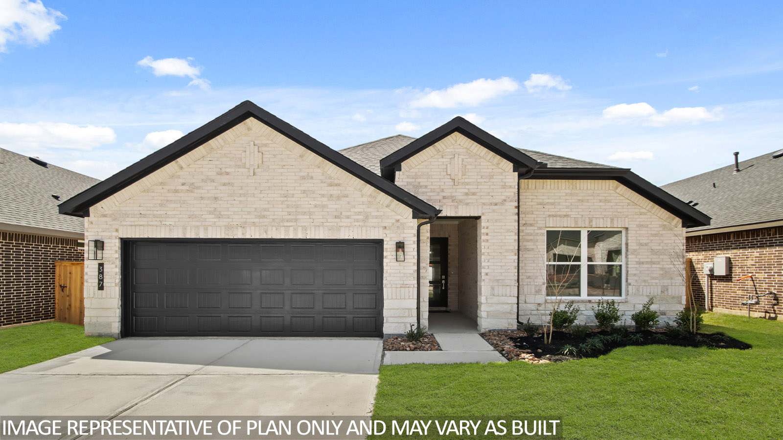 One story home with two car garage with brick and siding in New Waverly TX