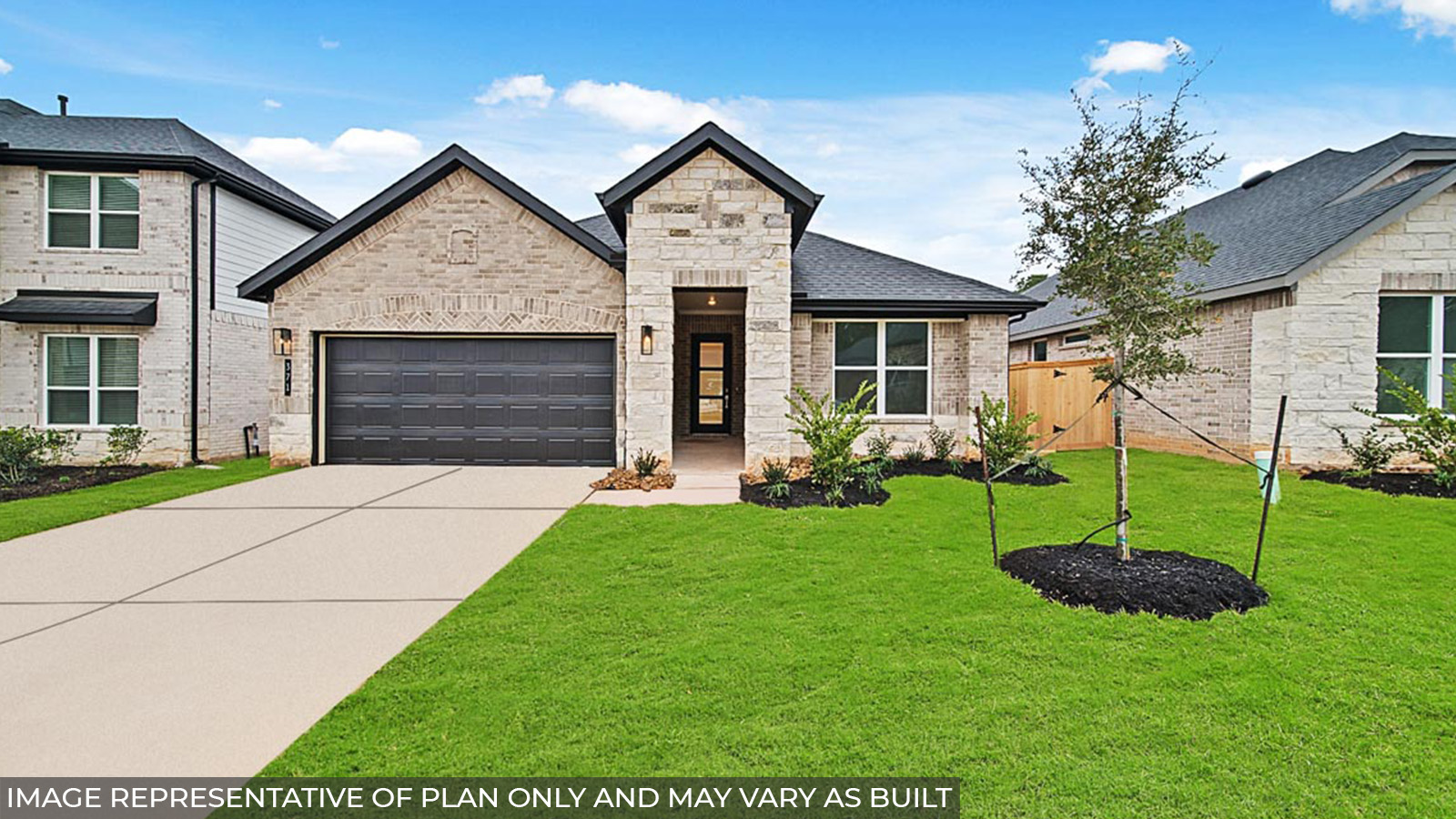 One story home with two car garage with brick and siding in New Waverly TX