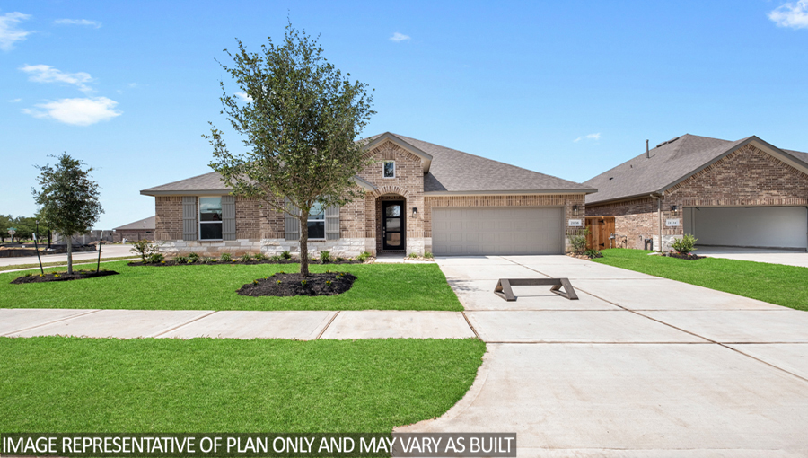 One story home with two car garage with brick and siding in New Waverly TX