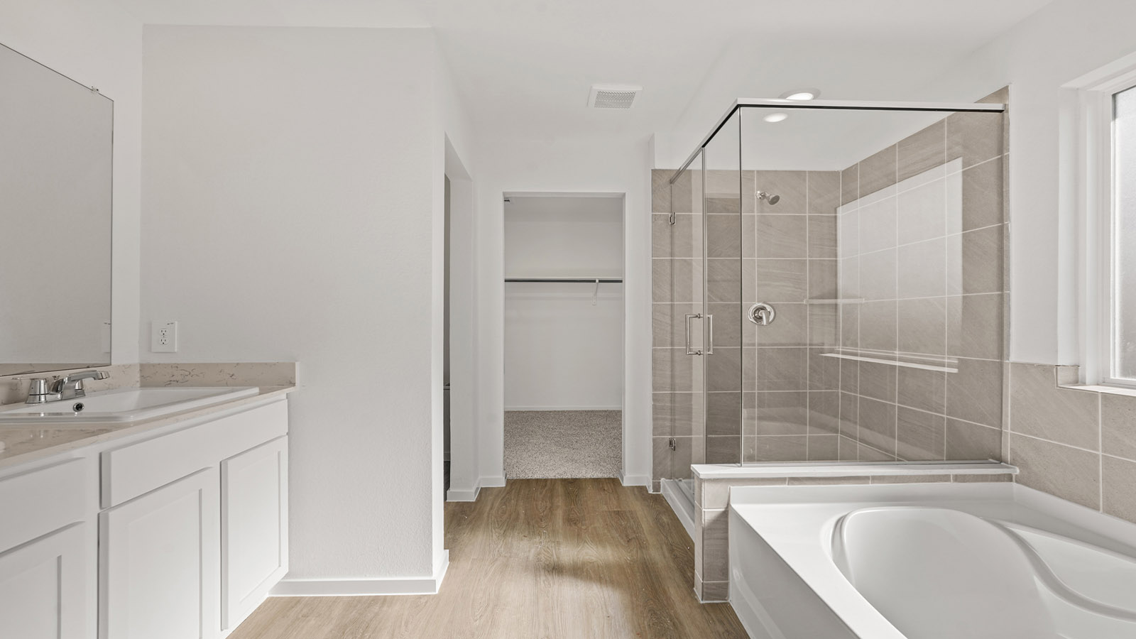 Primary bathroom with tub and shower