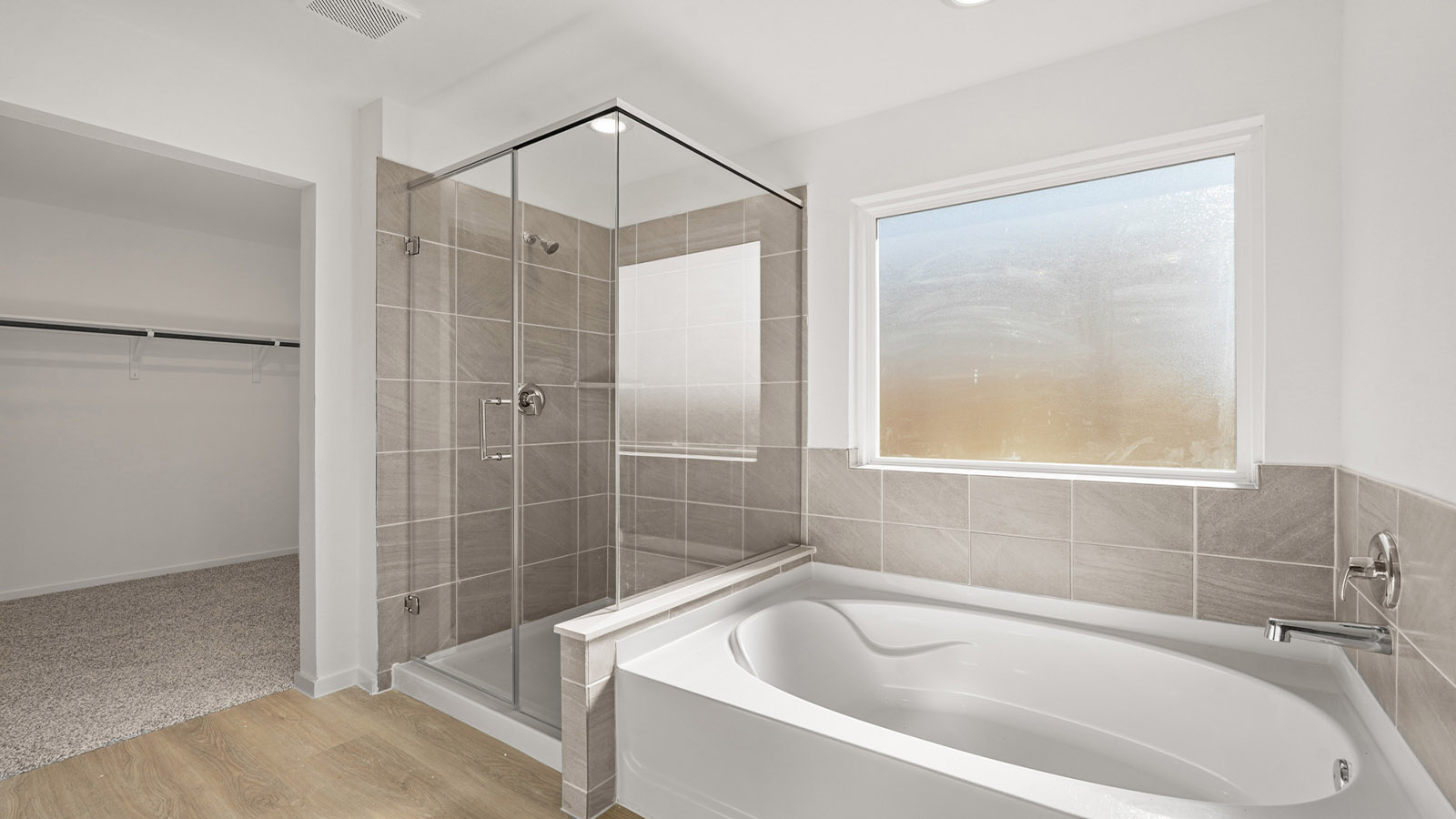 Primary bathroom with tub and shower