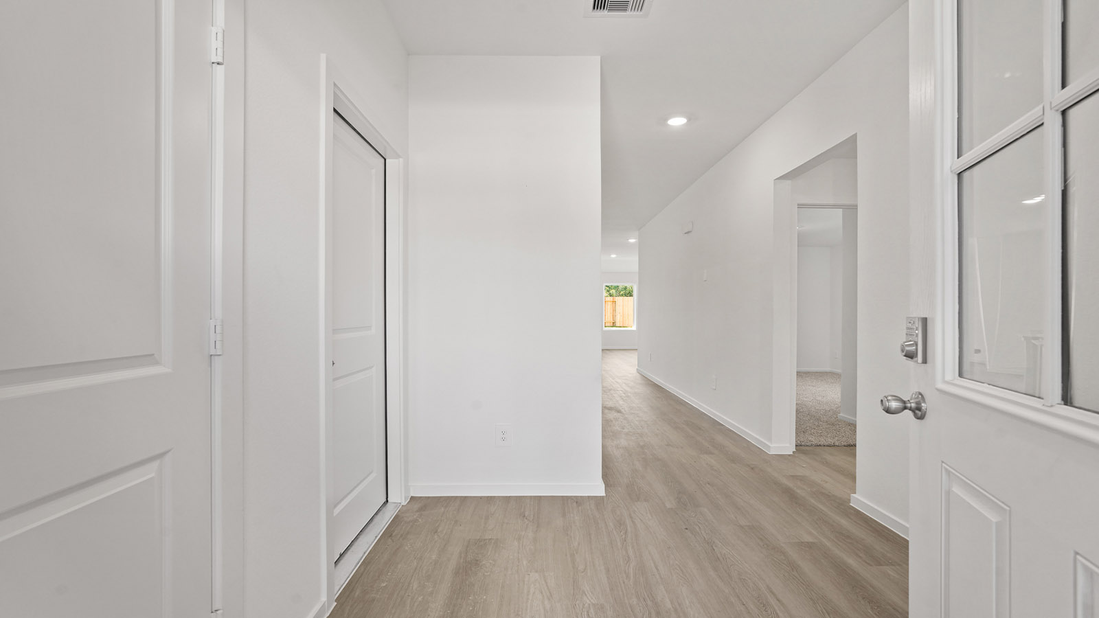 Entry hallway with vinyl flooring