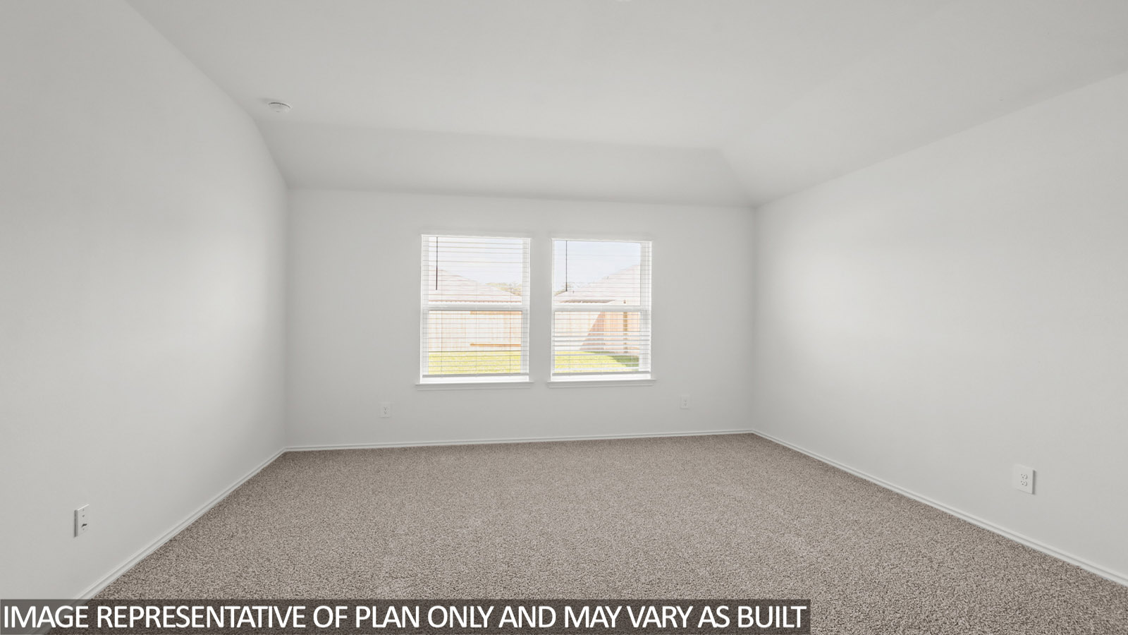 Primary bedroom with carpet flooring