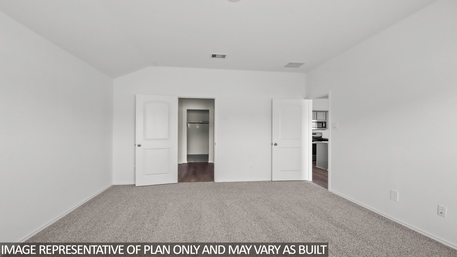Primary bedroom with carpet flooring