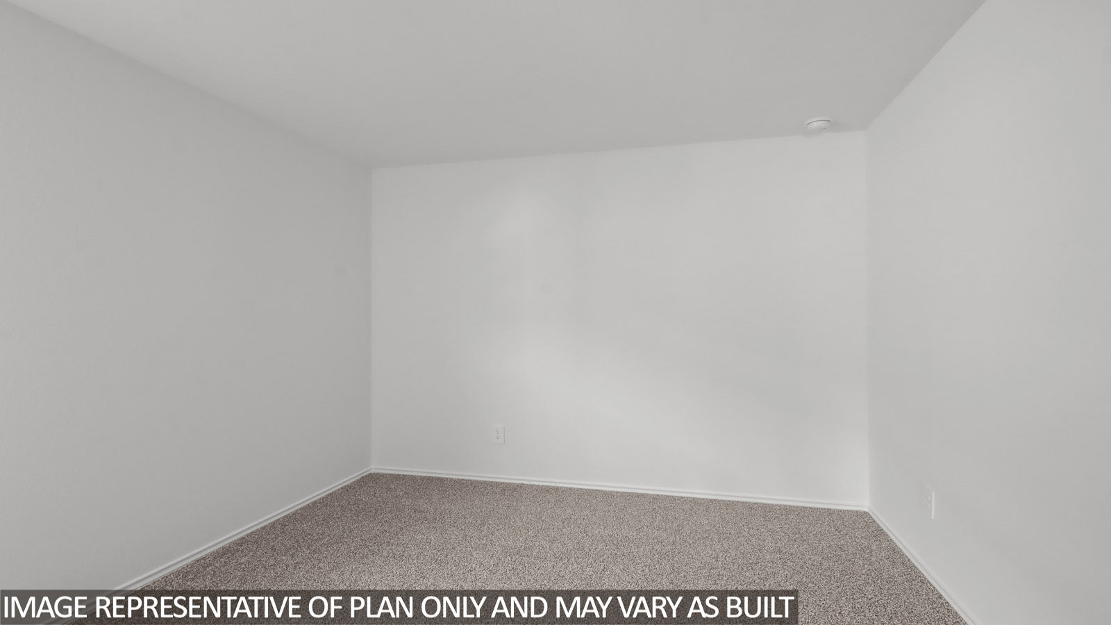 Secondary bedroom with carpet flooring