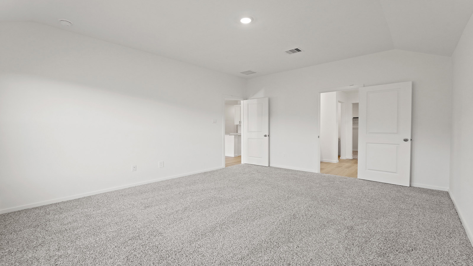 Primary bedroom with carpet flooring