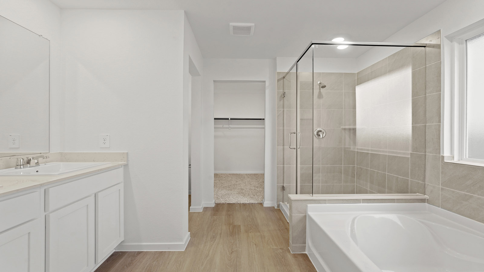 Primary bathroom with tub and shower