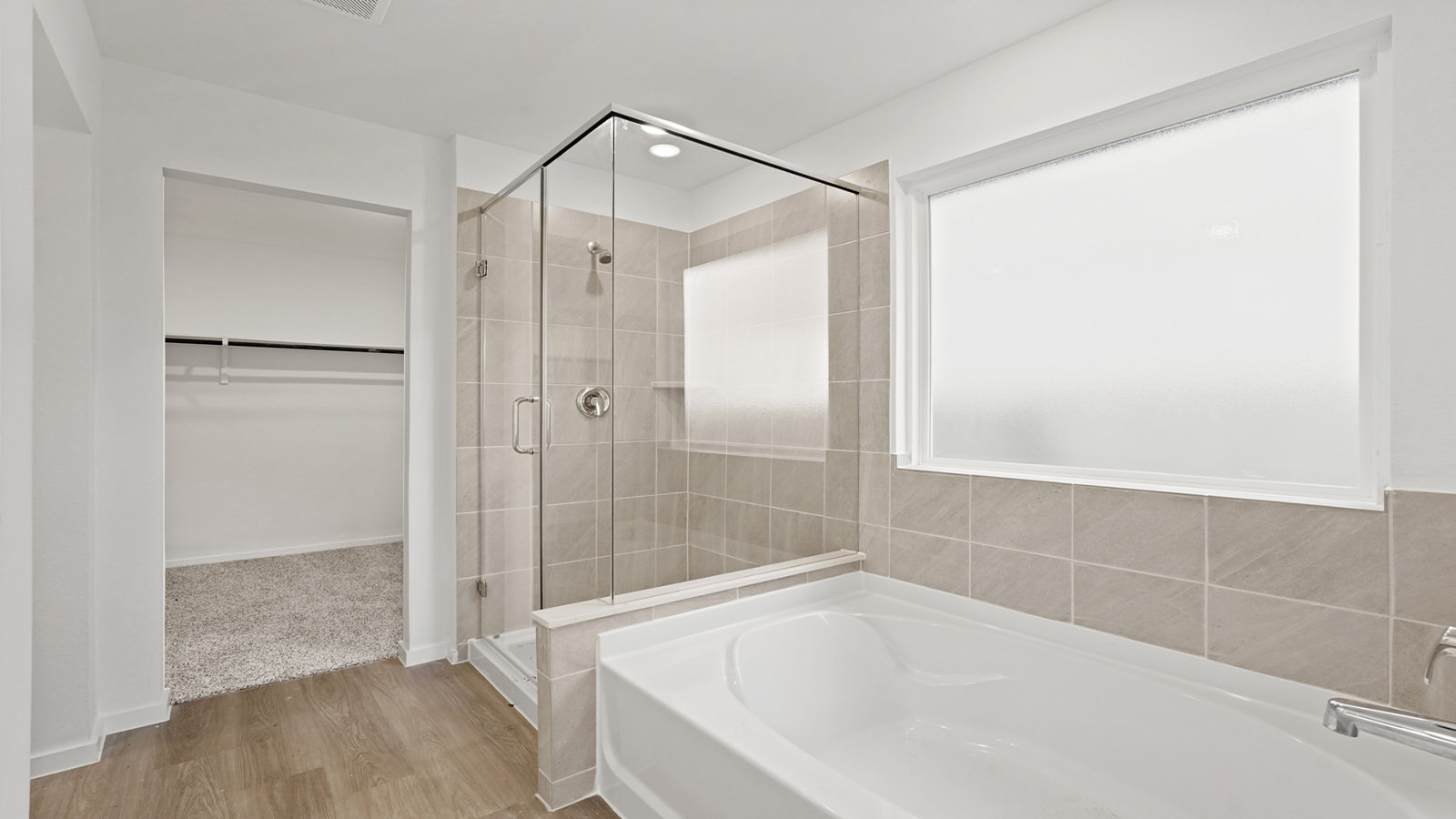 Primary bathroom with tub and shower