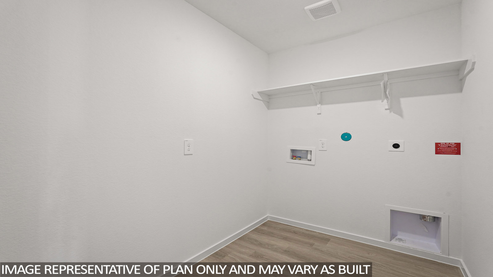 Utility room with storage located off the entry hallway and garage door