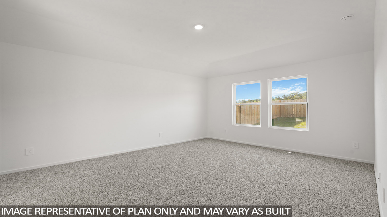 Large Primary bedroom with shag carpet flooring and bright window