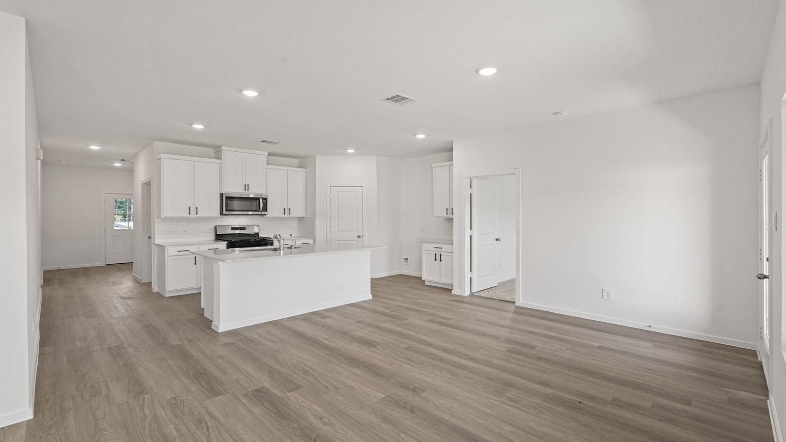 Open concept living, dining, and kitchen area