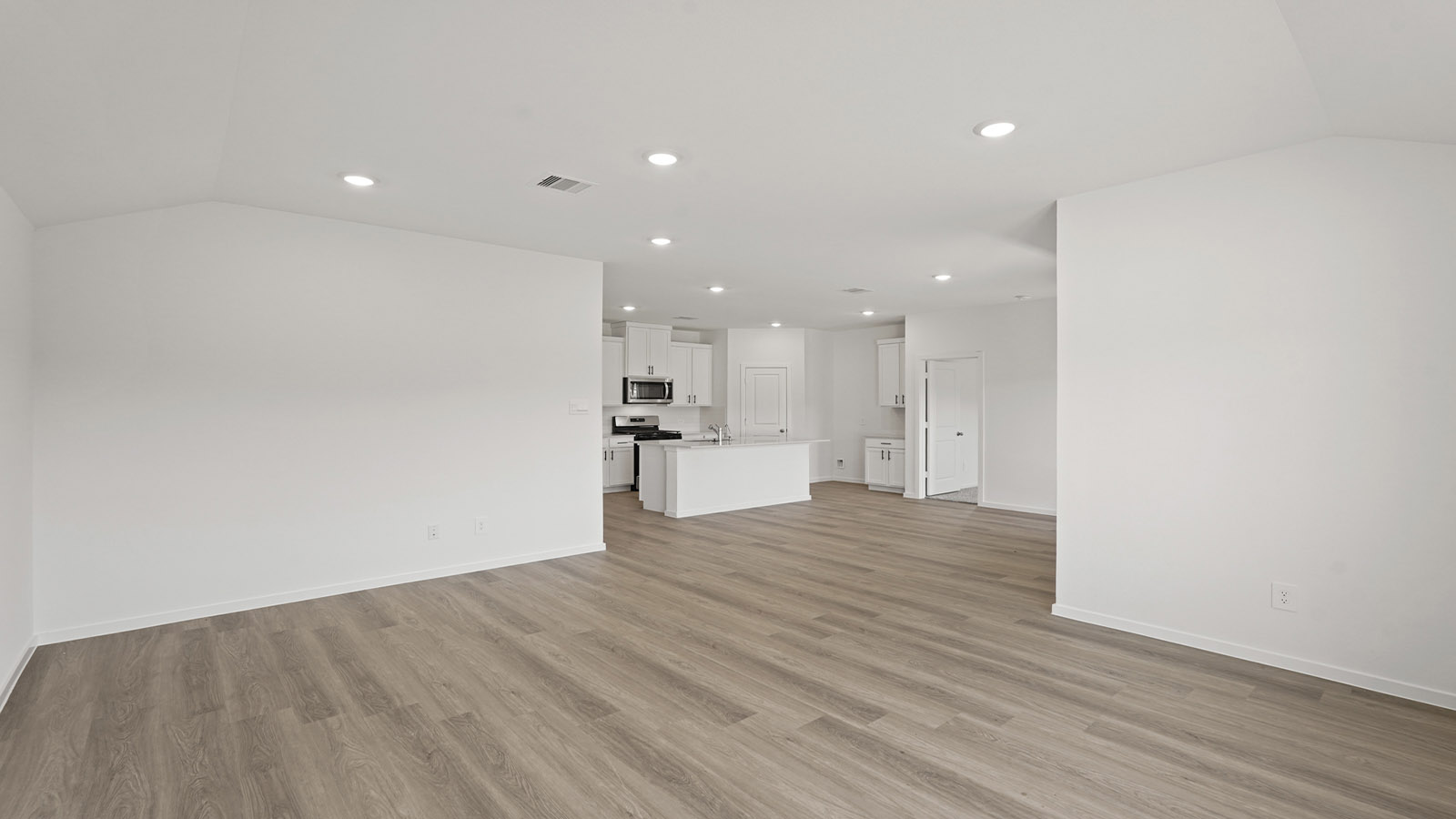 Open concept living, dining, and kitchen area