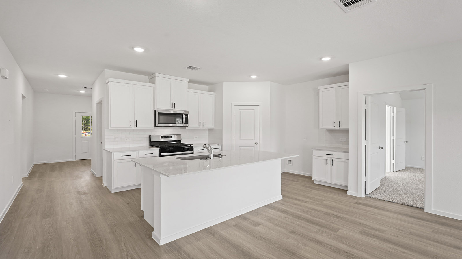 Open concept living, dining, and kitchen area