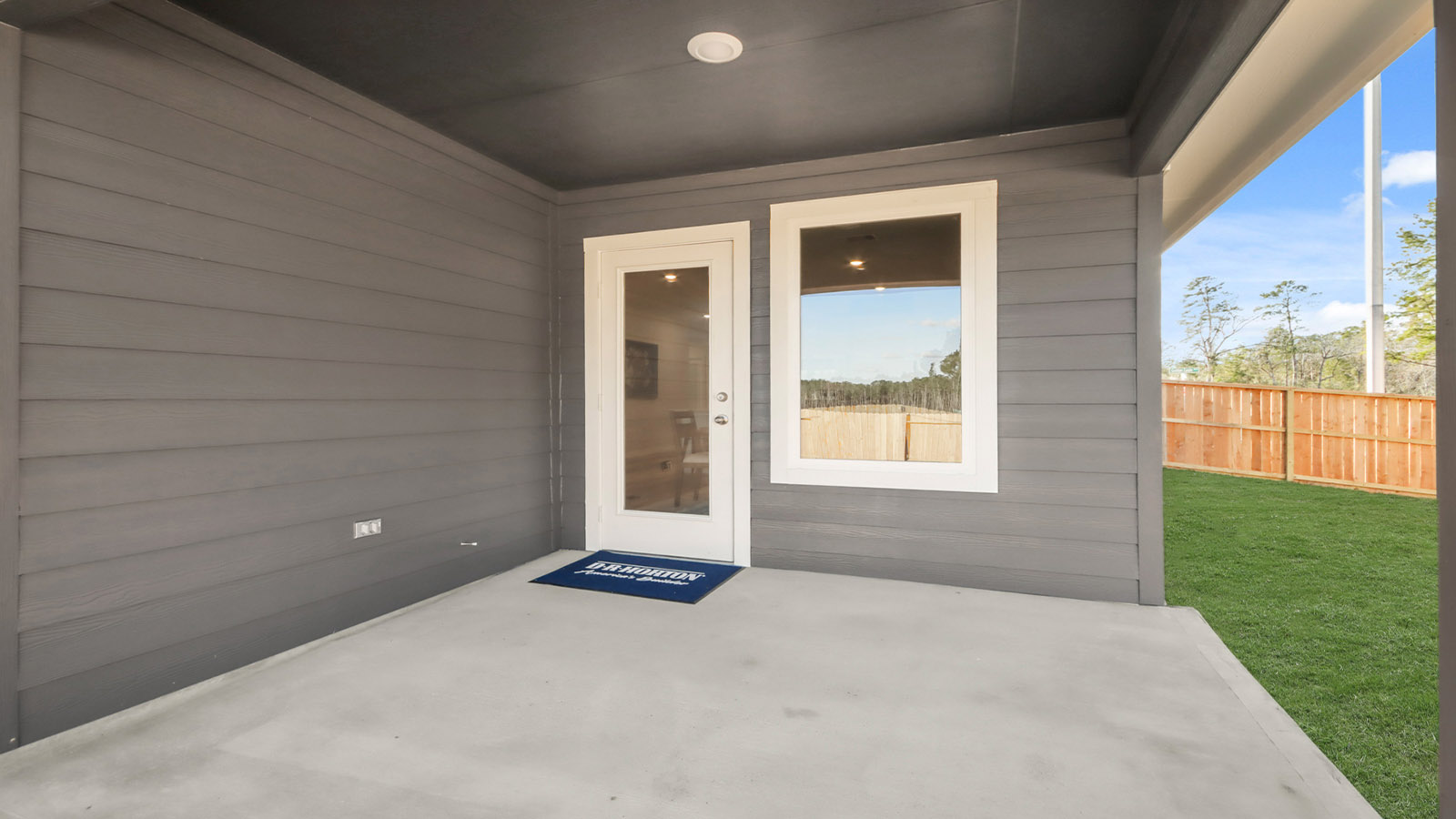 covered patio with overhead lighting